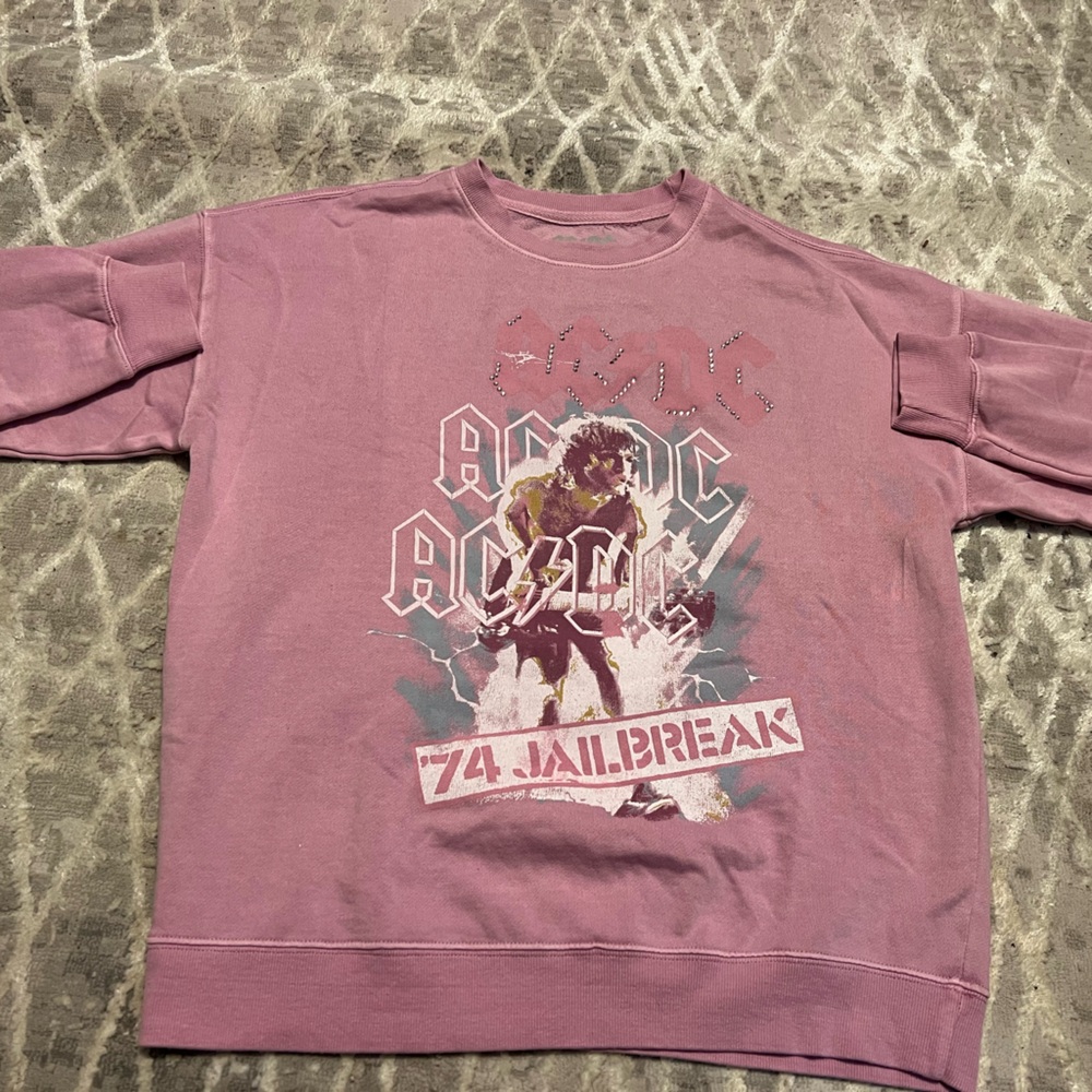 AC/DC Graphic women’s Sweater in pink ins a size small